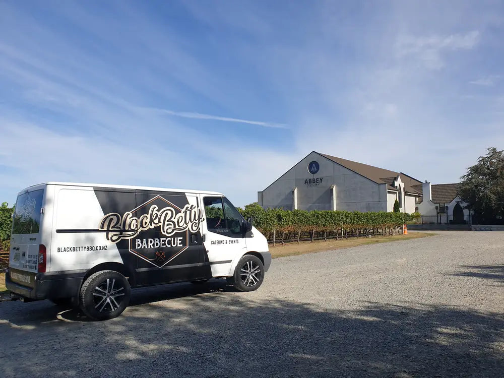 The Black Betty Barbecue catering van parked at a winery